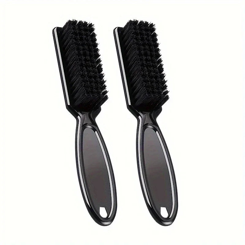 A pair of black grooming brushes for beard and hair
