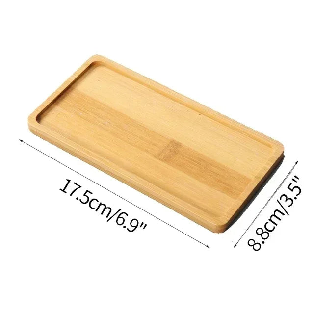 A wooden serving tray with dimensions 17.5cm x 8.8cm.