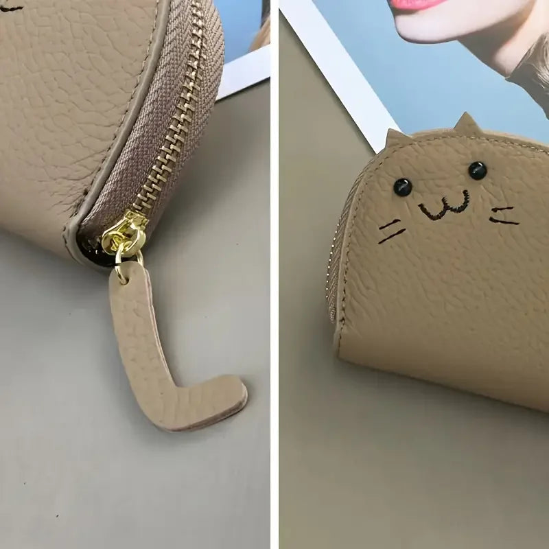 A light tan cartoon cat-shaped PU leather card wallet with a zipper pull.