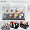 A clear acrylic display case containing various LEGO minifigures and collectibles, shown with an open lid.
