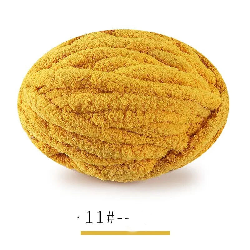 A ball of bright yellow extra thick chenille yarn used for hand knitting projects.