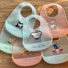 A set of five adjustable soft silicone baby bibs featuring various cute cartoon animal prints in pastel colors.