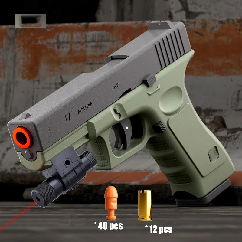 A light green toy pistol is shown with a shell ejecting mechanism and ammunition pellets in front of it.