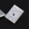 A silver carbon fiber wallet with a leather edge and a metallic emblem is shown on a dark background.