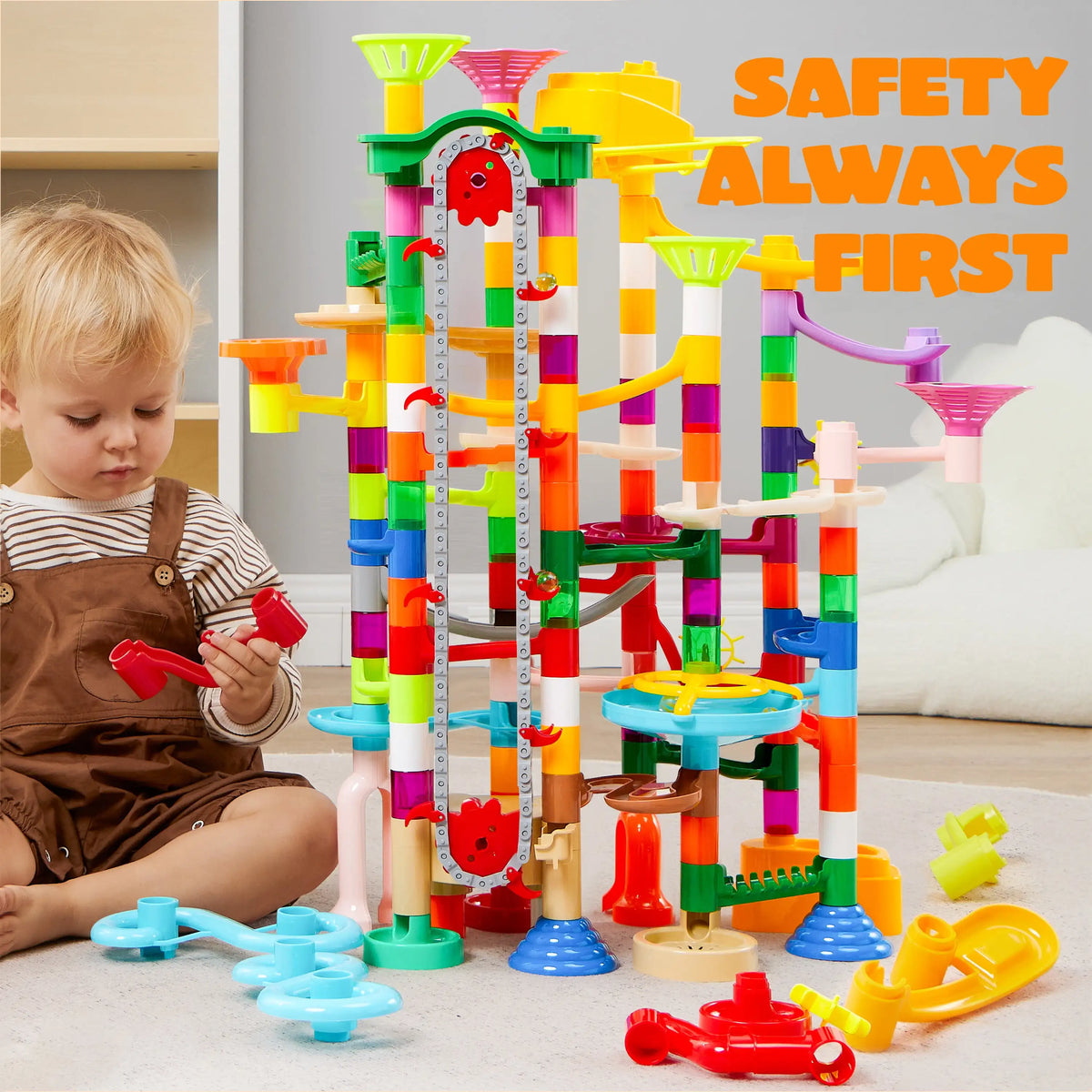 A colorful marble run with a motorized elevator and various building pieces for children.