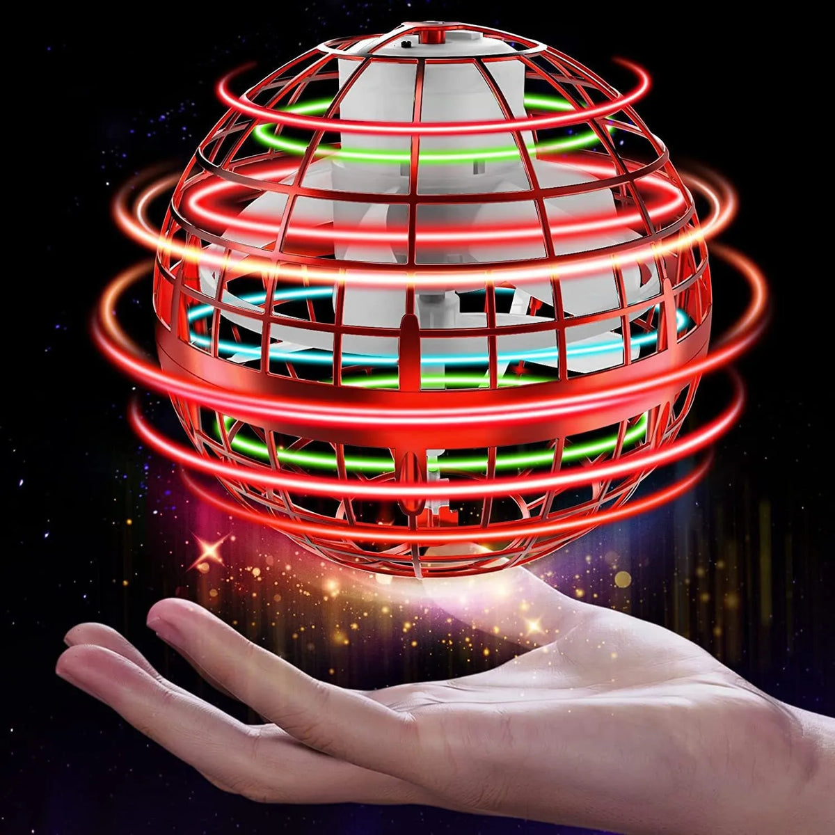 A hand holds a glowing, spherical magic flying ball with red and green LED lights orbiting around it.