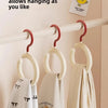 A white scarf hanger is displayed on a wooden rack, showing how to hang a scarf.