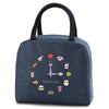Dark blue insulated lunch bag with a handle featuring various food icons like a fork, sandwich, and apple.