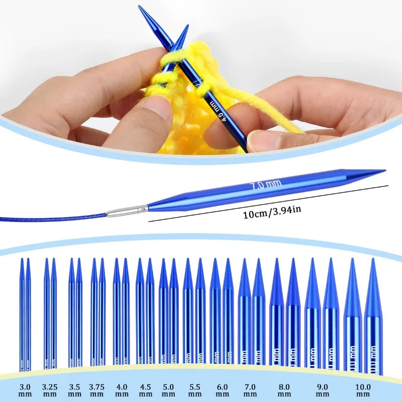 A hand holds a yellow knitted item with blue and yellow knitting needles and a separate blue needle.