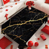 Black gold marble waterproof tablecloth displayed on a white surface with red accents.