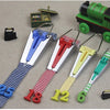 A set of four stainless steel bias tape makers with different sized clips and tapes in blue, red, yellow, and green.