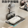 A hand points to a wall-mounted soap dish with a suction cup, designed to prevent hand germ spread.