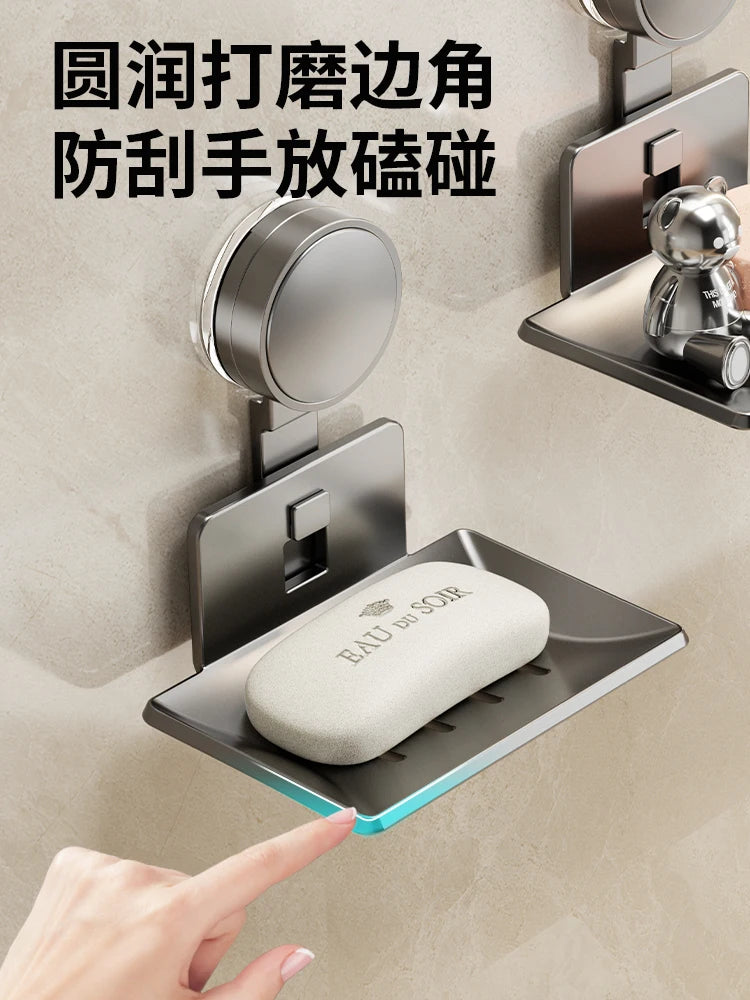 A hand points to a wall-mounted soap dish with a suction cup, designed to prevent hand germ spread.