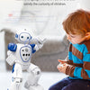 A child is interacting with a white robot toy, which is designed to teach machine language concepts.