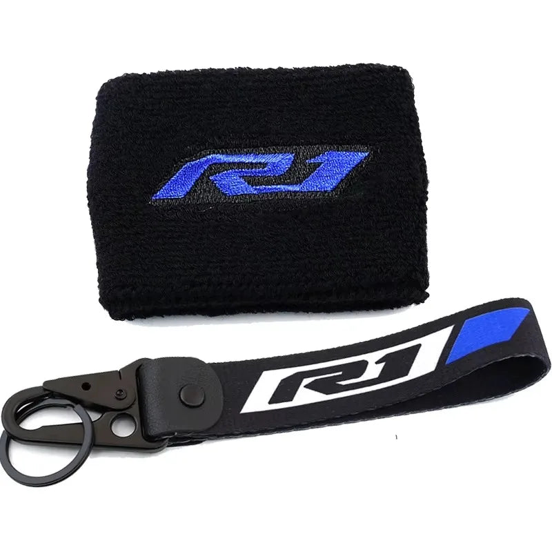 Black neoprene cover sock with a blue Yamaha R1 logo and a black strap for brake fluid reservoir.