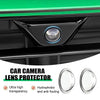 A close-up view of a black car camera lens protector installed on a vehicle, showing its clear, dome-shaped lens.
