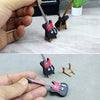 A hand holds a miniature 1:12 scale dollhouse piano with a bench, a small musical instrument decor.