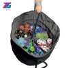 A dark gray velvet pouch with a drawstring opening filled with various colored dice.