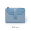 Light blue bi-fold wallet with gold zipper and textured fabric detail