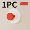 One piece of a red suction cup hook product shown against a light background.