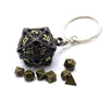 A set of black metal dice with a hollow box and a silver keyring attached.