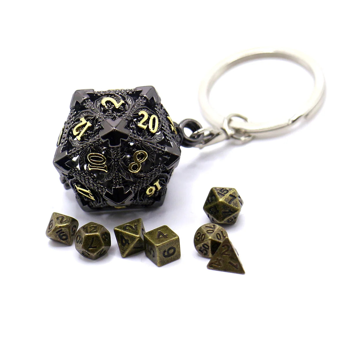 A set of black metal dice with a hollow box and a silver keyring attached.
