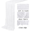 A white semi-sheer gauze table runner with a clean edge shown in detail.