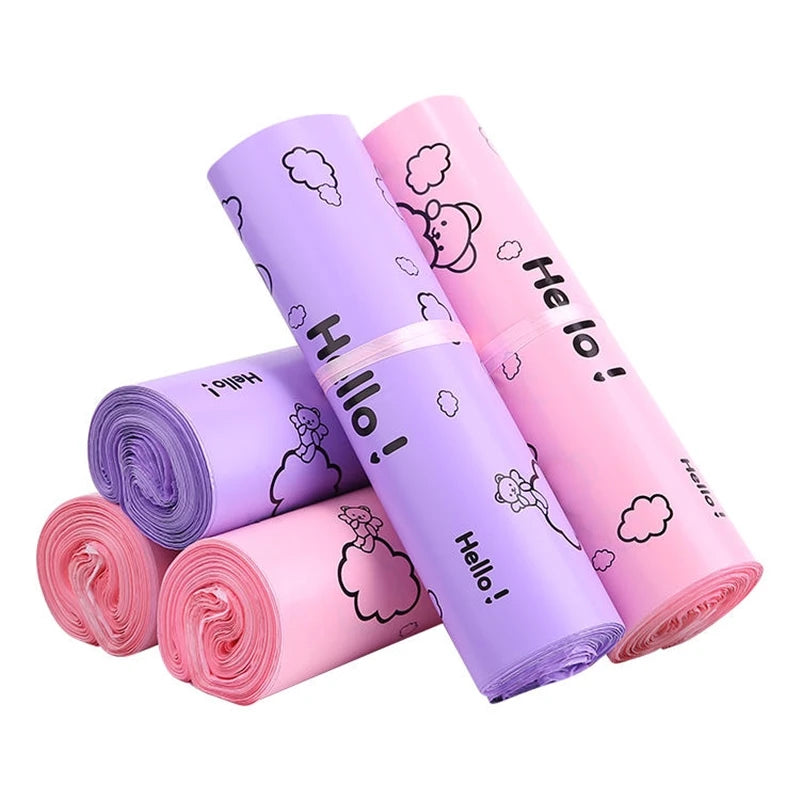 A stack of purple and pink self-sealing mailing bags featuring a Hello bear design.