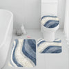 A set of three blue and white striped bathroom rugs, including a U-shaped toilet mat and cover.