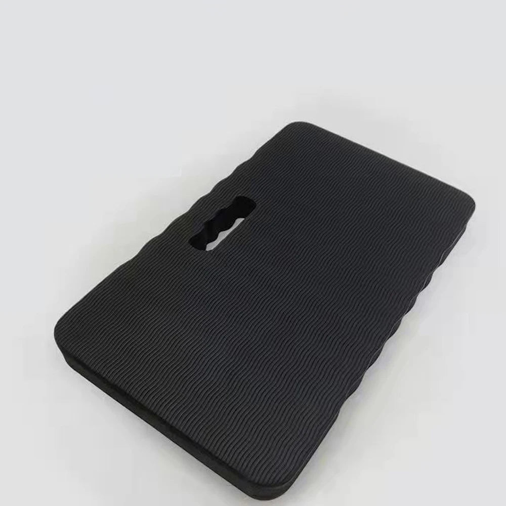 Black high-density foam kneeling pad with a handle for gardening, yoga, and work.