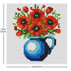 A cross stitch design featuring a bouquet of orange and red flowers in a blue vase.