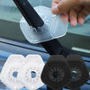 A hand is placing a clear silicone windshield wiper arm hole cover onto a black wiper arm, with two white and two black cover