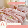 Pink bubble yarn summer cool quilt with a stuffed animal and a plate on the bed