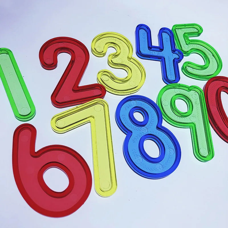 A colorful set of transparent plastic numbers 2 through 9, used for counting and Montessori math learning.