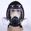 A full face respirator mask with a clear visor and white filter cartridge displayed on a mannequin head.