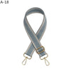 A gray and beige patterned jacquard strap for an adjustable crossbody bag.