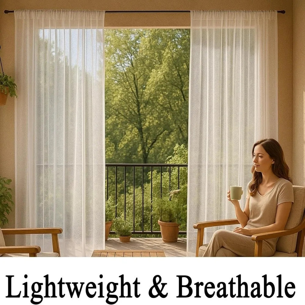 A woman sits on a wooden bench looking out through sheer white curtains at a lush green garden view.