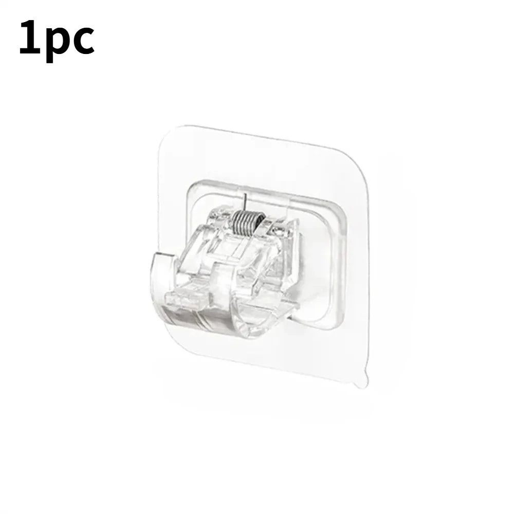 A clear self-adhesive curtain rod hook is shown, designed for hanging curtains.