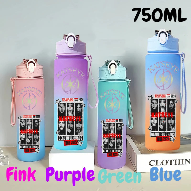 Three 750ml portable sports water bottles in pink, purple, and blue with leak-resistant lids displayed on a white surface.
