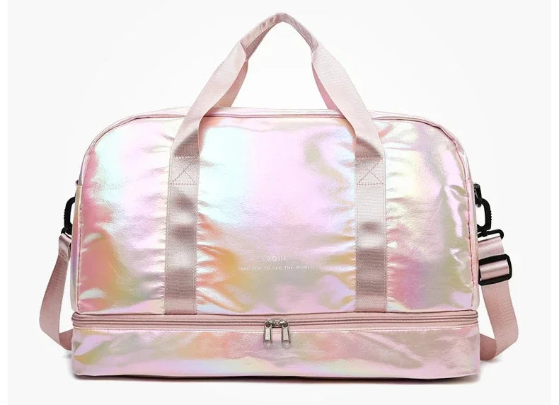 A pink iridescent travel duffel bag with light pink straps and a silver zipper.
