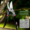 A pair of black precision pruning shears with a silver blade are shown gripping a tree branch.