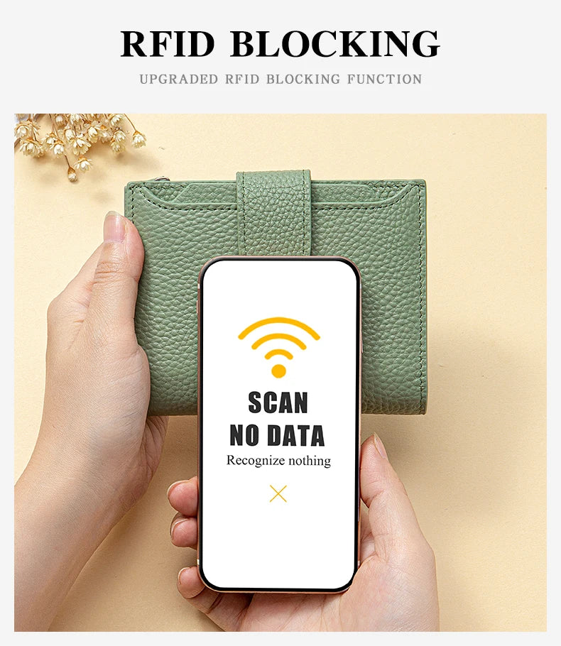 A hand holds a green leather RFID blocking bi-fold wallet, demonstrating its function to scan no data.