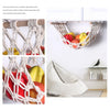 Macrame hanging fruit hammock made of white rope used for kitchen storage