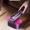 A hand is holding a purple graphene flash nano dry steam iron, demonstrating its professional quality and features.