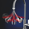 A close-up view of a chrome kitchen faucet adapter with multiple rotating spray heads and flow settings.
