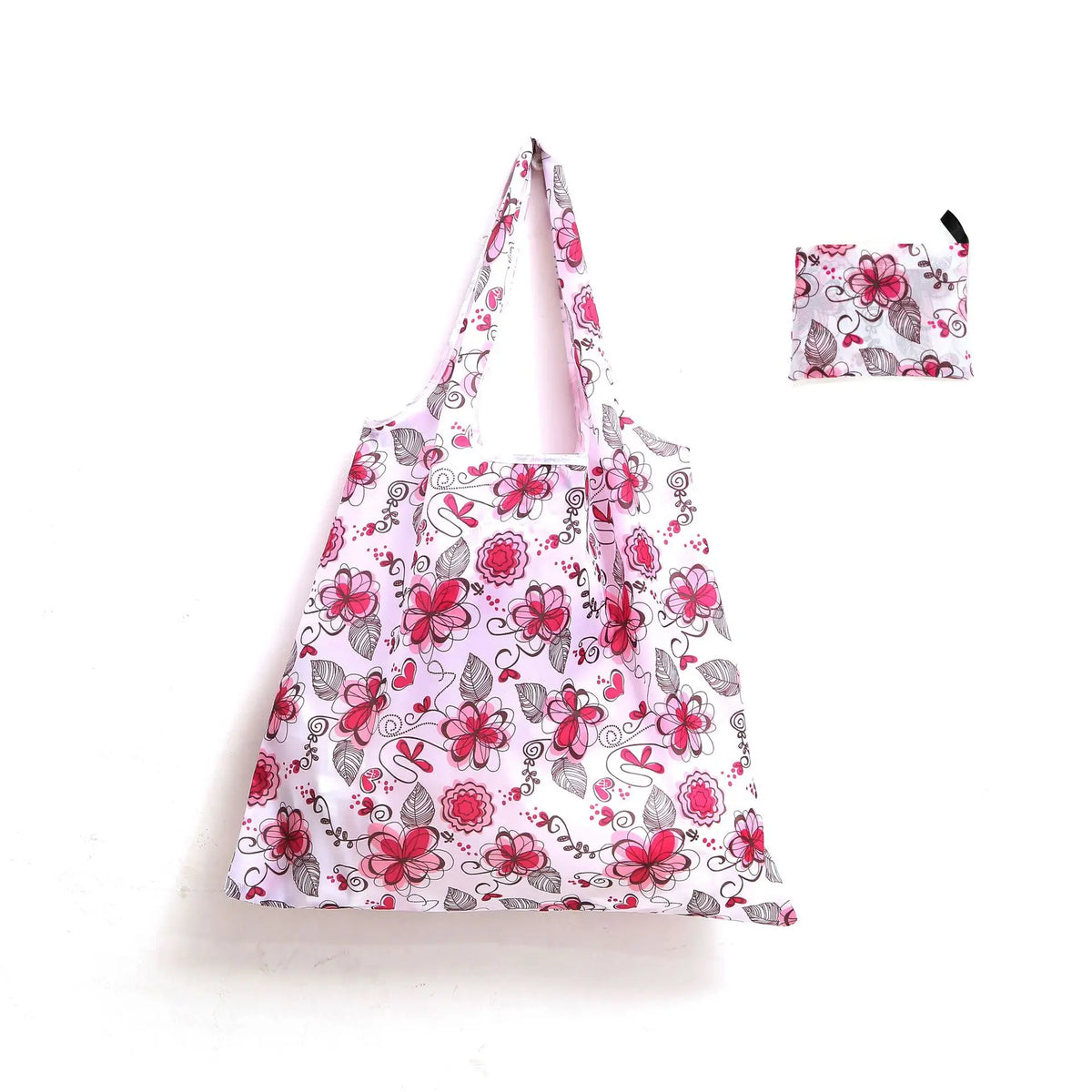 A pink floral patterned reusable shopping tote bag with an attached carry pouch.