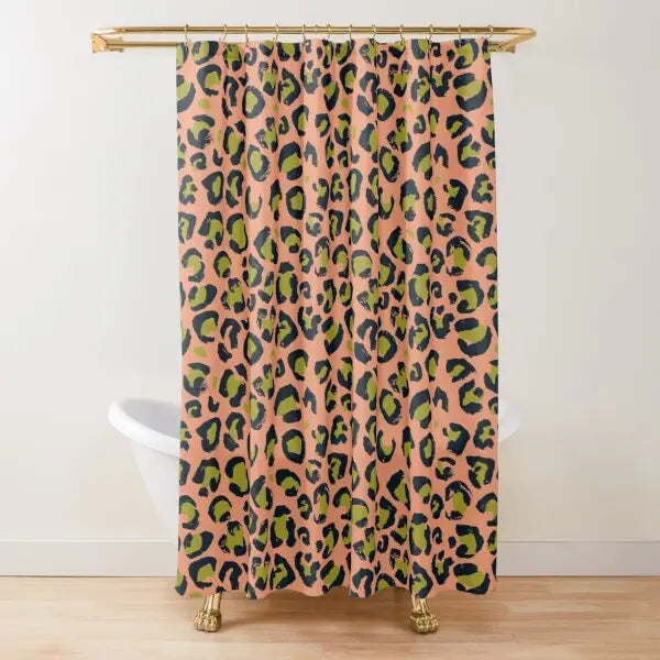 A shower curtain featuring a leopard print pattern in shades of orange, green, and black.
