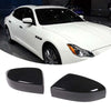 Black carbon fiber side mirror covers for a white Maserati Ghibli or Quattroporte car.