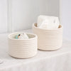 A natural beige handwoven cotton rope storage basket filled with white tissues for desk organization.
