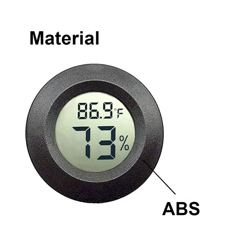 A black circular device made of ABS material displaying a temperature of 86.9°F and 73% humidity.